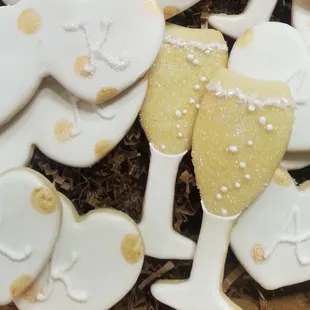 Champagne flutes and heart initial wedding cookies
