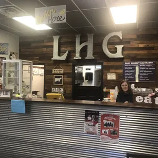 a woman behind the counter