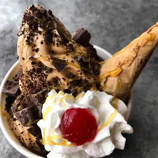 two scoops of ice cream with a cherry on top