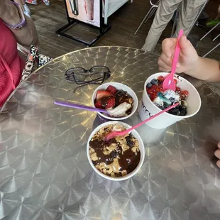two bowls of ice cream and strawberries