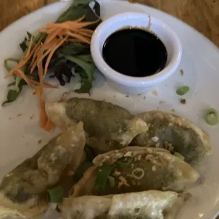Happy hour prices of veggie dumplings are six dollars