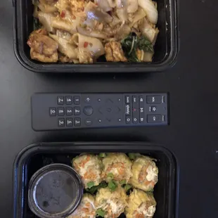 Friend Tofu Drunken Noodles without peppers and tomatoes, and steamed dumplings. (Remote for portion reference)