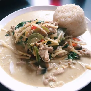 Green curry with stick rice. I got it with brown chicken and thai spicy!
