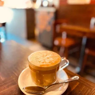 a cup of cappuccino on a saucer