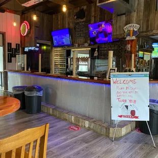 a welcome sign in the bar