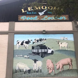 farm animals painted on the side of a building