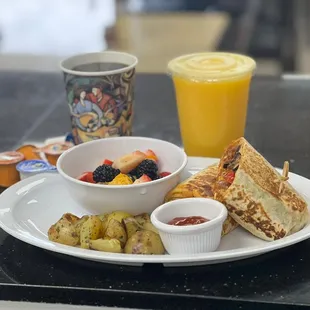 Breakfast Burrito with side of roasted potatoes and fresh  fruit