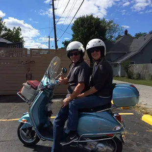 two people on a scooter
