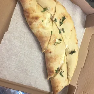 a slice of pizza in a box