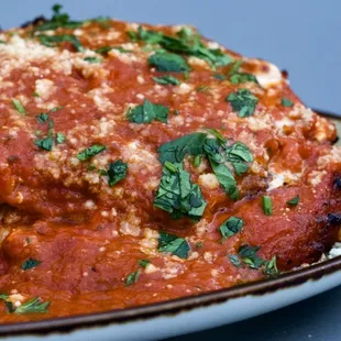 Eggplant Parmigiana. Slightly Acidic but cheesy.