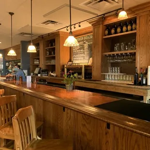 a bar with wooden bar stools