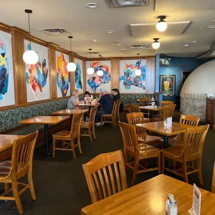 a dining area with tables and chairs
