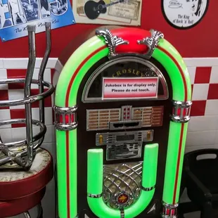 a juke box and stool