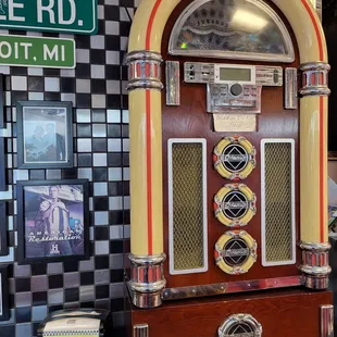 a juke box and a sign