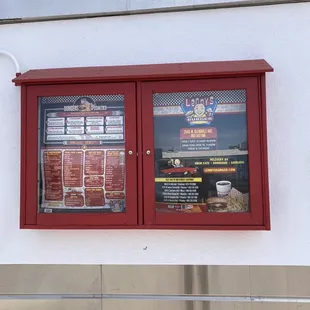 the menu and window of the restaurant