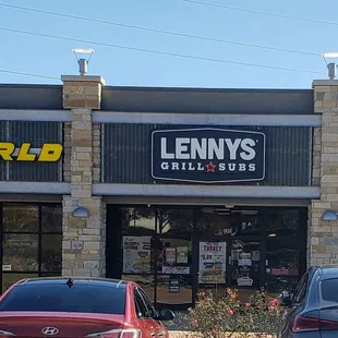 two cars parked in front of the restaurant