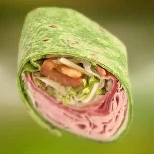 a wrap of meat and vegetables