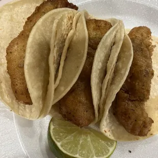 Fish tacos with topping on the side ( not pictured)