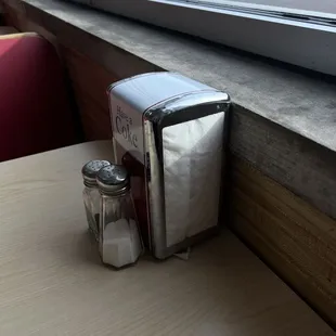 a table with salt and pepper shakers
