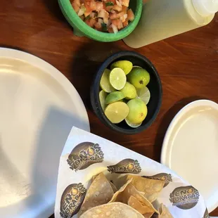 They include limes and pico de gallo with the chips.