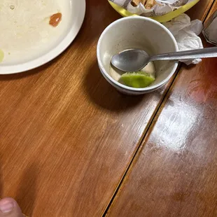 a plate of chips and a bowl of salsa