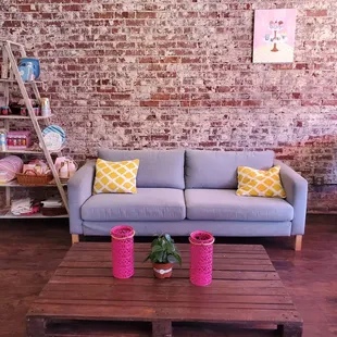 a living room with brick walls