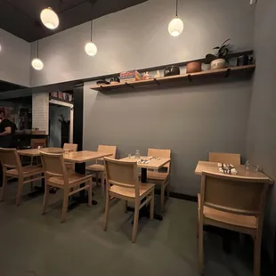 a dining area with tables and chairs