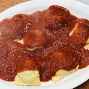 a plate of ravioli and meatballs