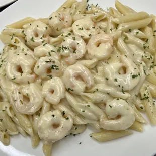 a plate of pasta with shrimp