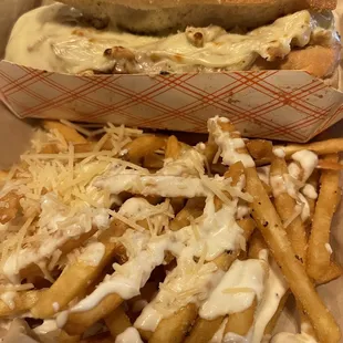 Filet mignon sandwich with Parmesan fries drizzled in garlic aïoli