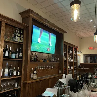 a bar with lots of bottles of wine