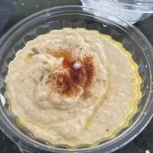 Hummus with white fungus on it indicating this is not fresh.