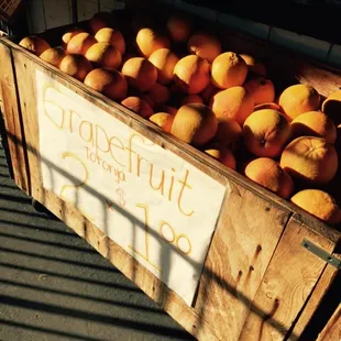 a crate of oranges for sale