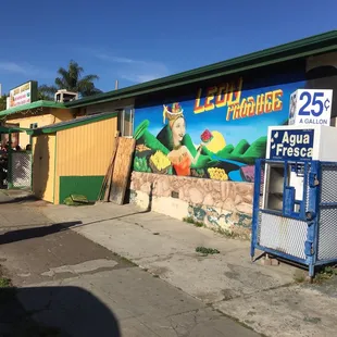 the side of a building with a mural on it