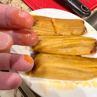 Beef tamales. Greasy, not very tasty (to me) and small.