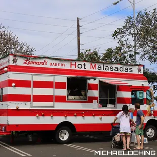a red and white food truck
