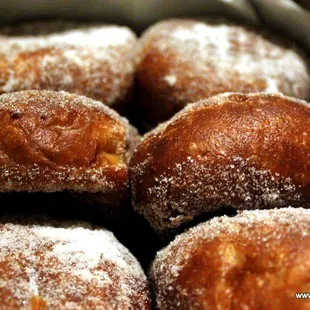 a close up of a box of doughnuts
