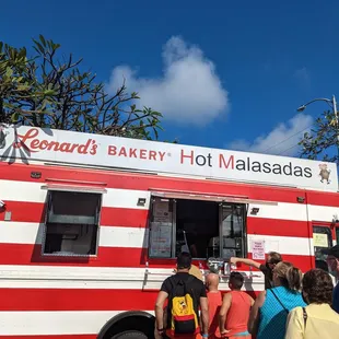 people ordering food from a food truck