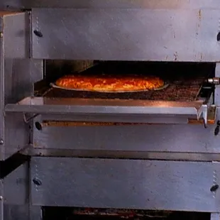 The 'Ultra-industrial, fully automated, stainless steel, gravity-belt-driven, mega-magic' Pizza Oven!  Hurray!