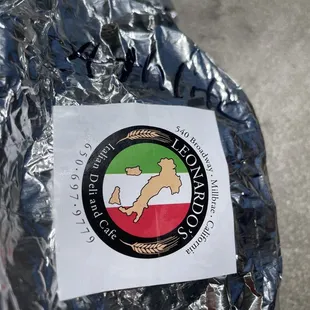 Their logo wrapped on their sandwich.