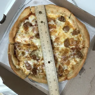 Small pepperoni and sausage pizza that is 8.5" long instead of the 9"