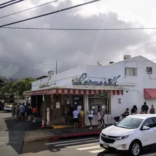 Line wraps around the building