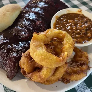 Half slab of ribs with beans and onion rings