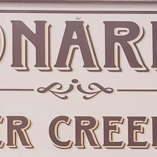 a sign for leonard's silver creek inn