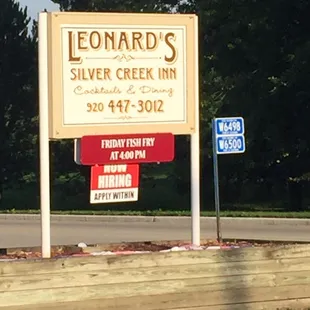 a sign for leonard's silver creek inn