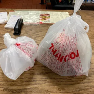 two bags of food on a table