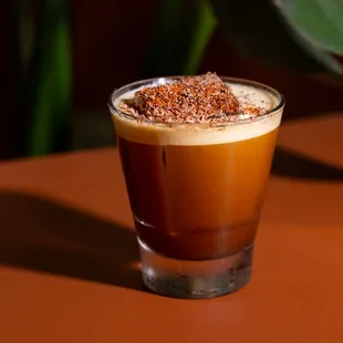 a shot of a coffee drink on a table