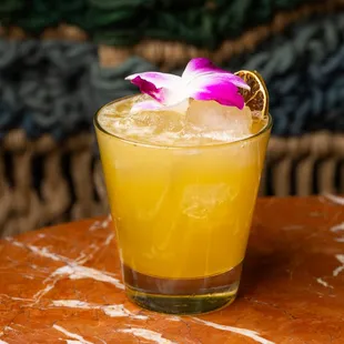 a glass of lemonade on a table