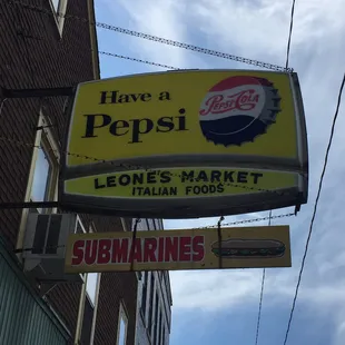 a pepsi sign on the side of a building