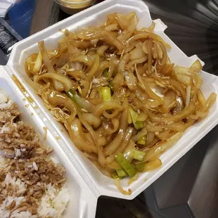 Mongolian beef wth over 1lb of white onions that is not part of dish.  It was light brown gravy over beef and onions.